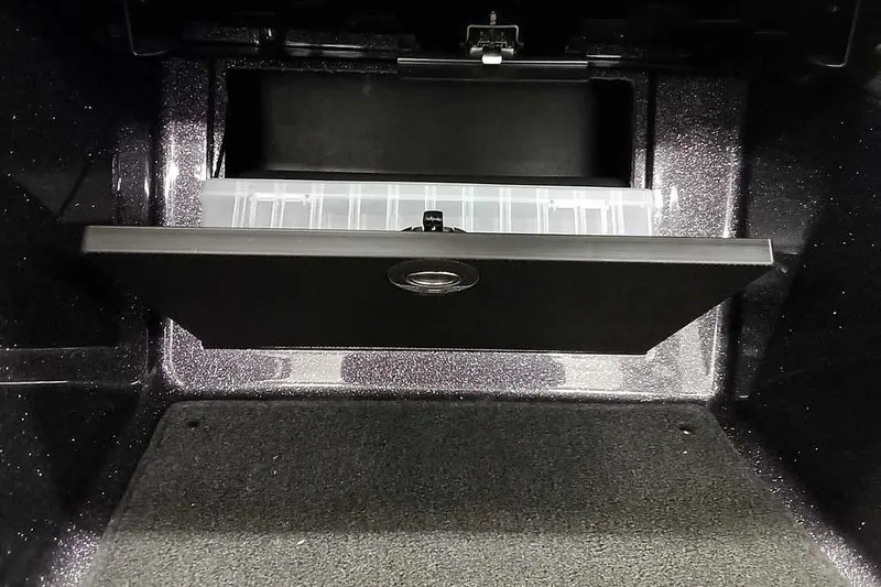 Slide: The Image of Storage compartment in 2026 Ranger 1880MS A Pack Equipped boat, featuring organized interior space. - 17