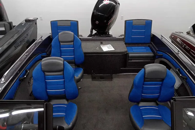 Slide: The Image of 2026 Ranger 1880MS A Pack Equipped boat interior with blue and black seating. - 23