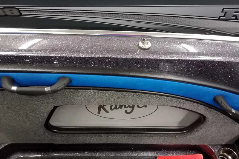 Slide: The Image of 2026 Ranger 1880MS A Pack Equipped boat interior with sleek design and blue accents. - 25