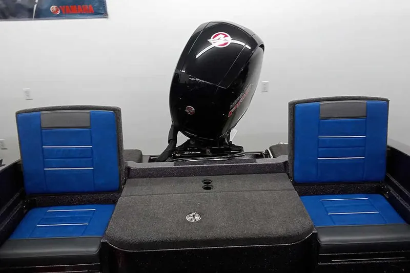 Slide: The Image of 2026 Ranger 1880MS A Pack Equipped boat interior with blue seats and Yamaha motor. - 26