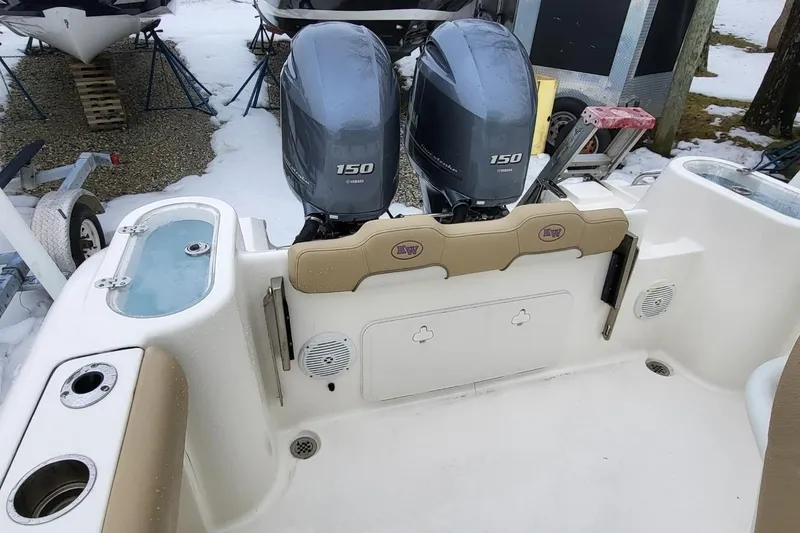 Slide: The Image of 2019 Key West 244 Center Console boat with twin Yamaha 150 engines in snowy setting. - 12