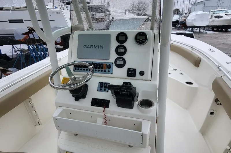 Slide: The Image of 2019 Key West 244 Center Console boat dashboard with Garmin navigation system. - 13