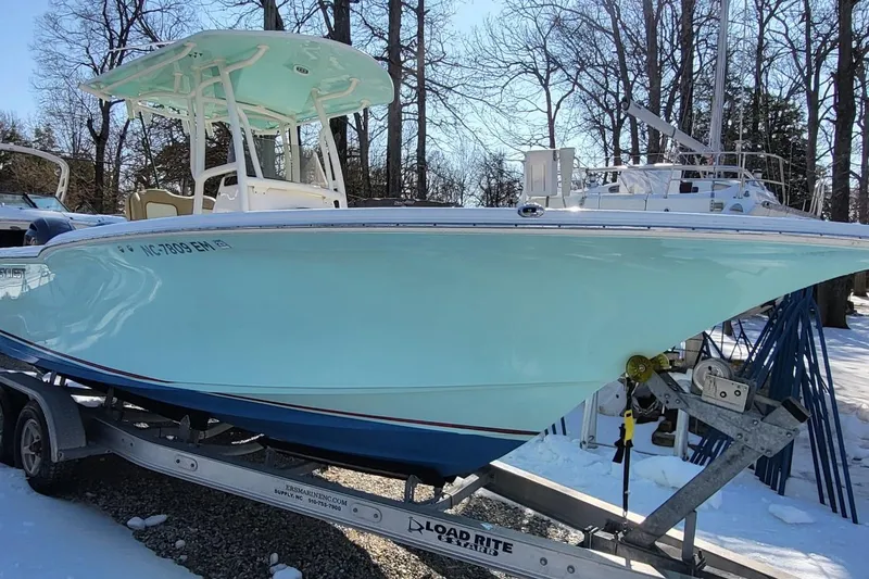Slide: The Image of 2019 Key West 244 Center Console boat on trailer in snowy setting. - 4