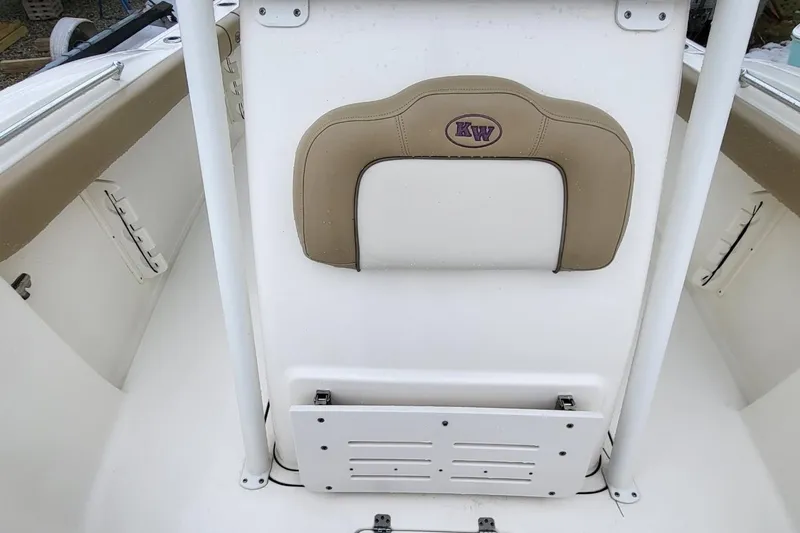 Slide: The Image of 2019 Key West 244 Center Console boat interior with beige and white seating. - 9