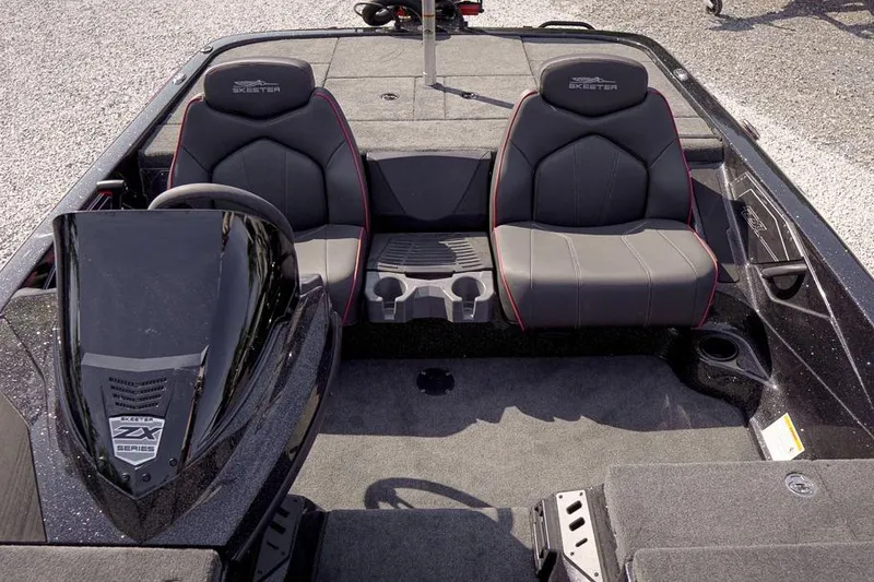 Slide: The Image of 2026 Skeeter ZX200 boat interior with dual seats and steering console. - 15