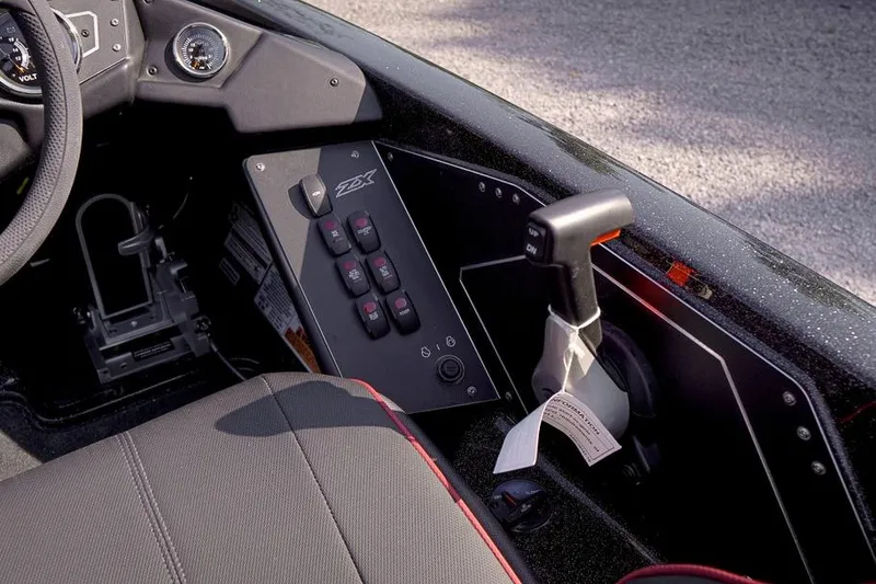 Slide: The Image of 2026 Skeeter ZX200 boat cockpit with control panel and steering wheel. - 17