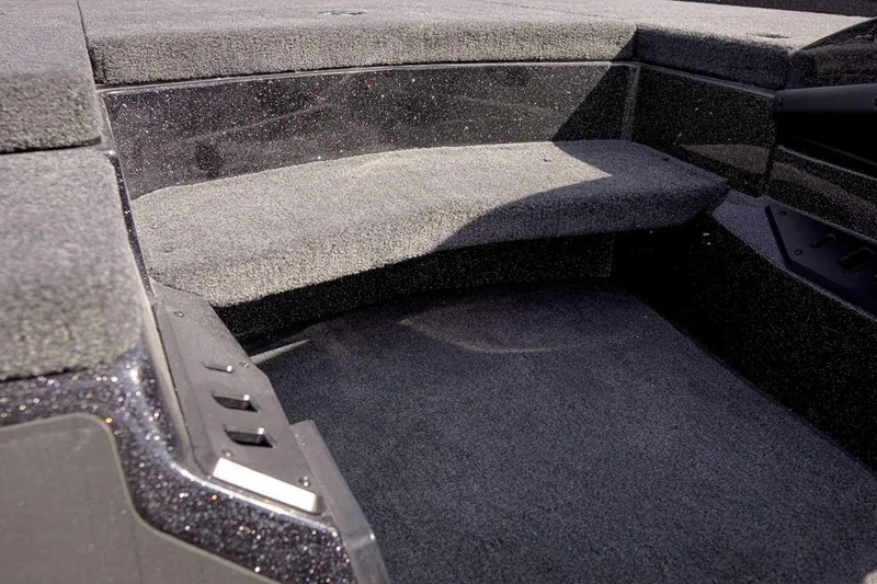 Slide: The Image of Interior of 2026 Skeeter ZX200 boat with carpeted seating area. - 20