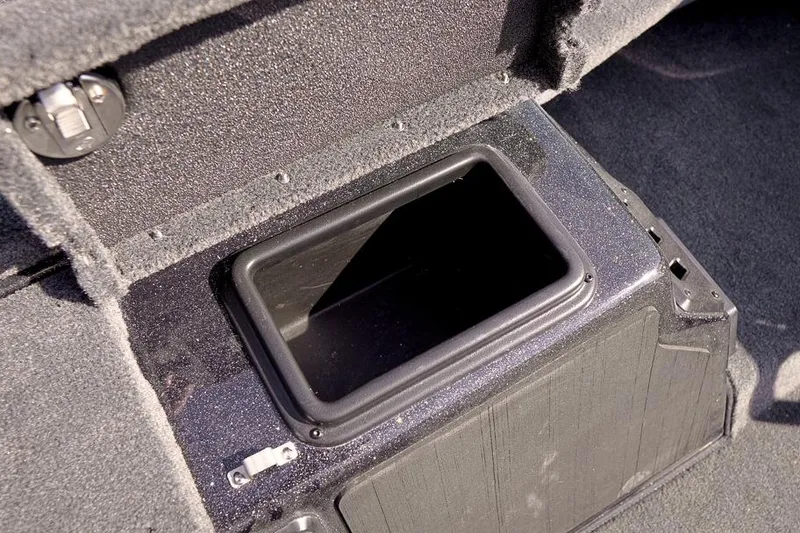 Slide: The Image of Storage compartment in 2026 Skeeter ZX200 boat, featuring a durable, carpeted interior. - 21