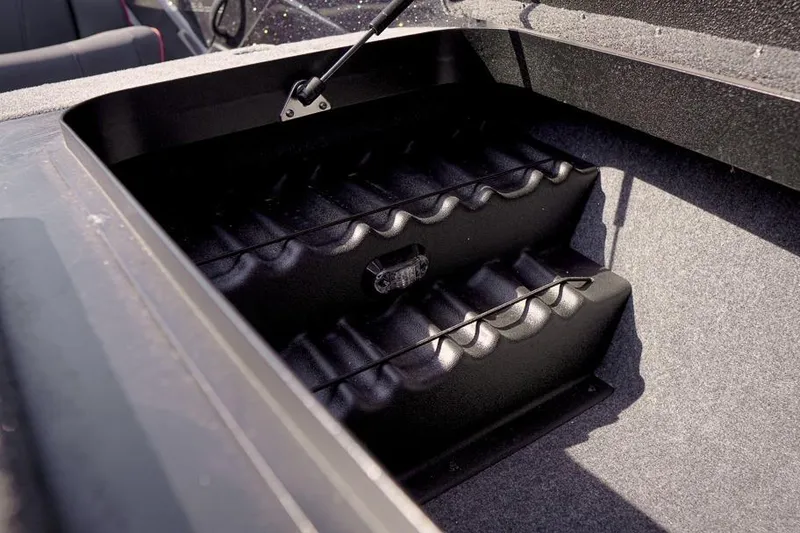 Slide: The Image of Storage compartment of 2026 Skeeter ZX200 boat, featuring organized interior design. - 25