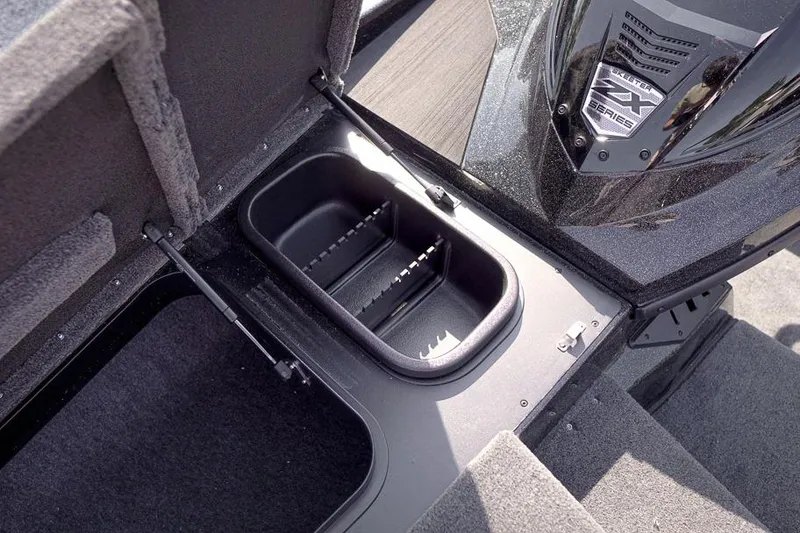 Slide: The Image of 2026 Skeeter ZX200 boat storage compartment with open lid, showcasing interior design. - 27