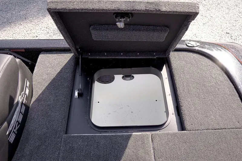 Slide: The Image of Open storage compartment on 2026 Skeeter ZX200 boat deck. - 32