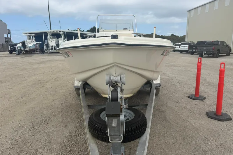 Slide: The Image of 2001 Scout 185 Sportfish boat on trailer in a parking lot. - 12