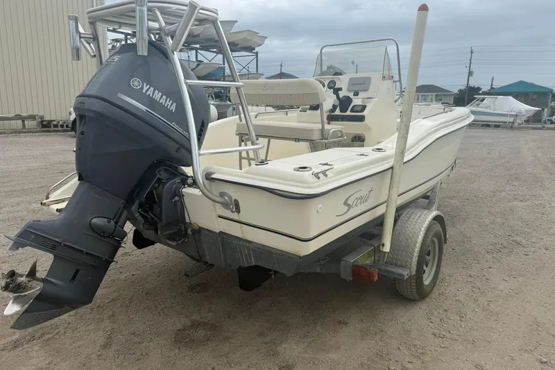 Slide: The Image of 2001 Scout 185 Sportfish boat with Yamaha outboard motor on trailer. - 15