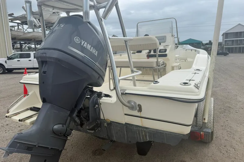 Slide: The Image of 2001 Scout 185 Sportfish boat with Yamaha outboard motor on a trailer. - 5