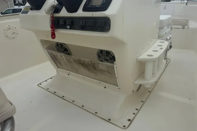 Slide: The Image of 2001 Scout 185 Sportfish boat console with speakers and rod holders. - 7