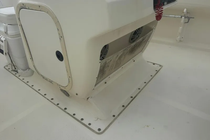 Slide: The Image of 2001 Scout 185 Sportfish boat interior showing storage compartment and seating area. - 9