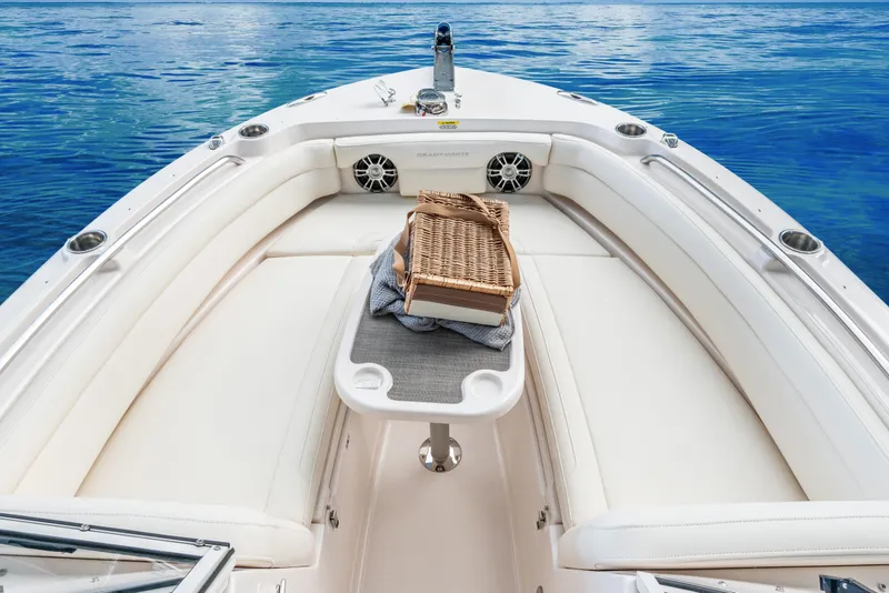 Slide: The Image of 2025 Grady-White Freedom 235 boat interior with cushioned seating and ocean view. - 14
