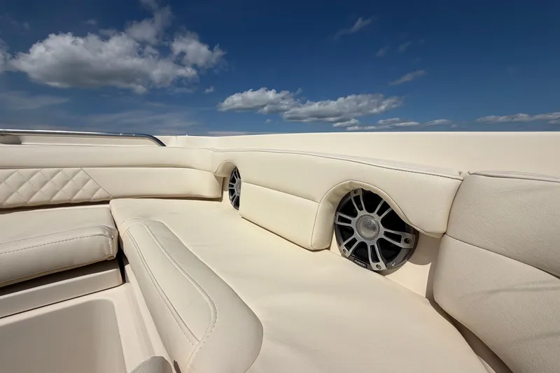 Slide: The Image of Luxurious seating on 2025 Grady-White Freedom 235 boat under clear blue sky. - 20