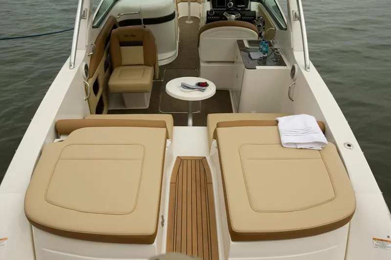 Slide: The Image of Manufacturer Provided Image: 2015 Sea Ray 300 SLX boat interior with tan seating and wooden flooring. - 10