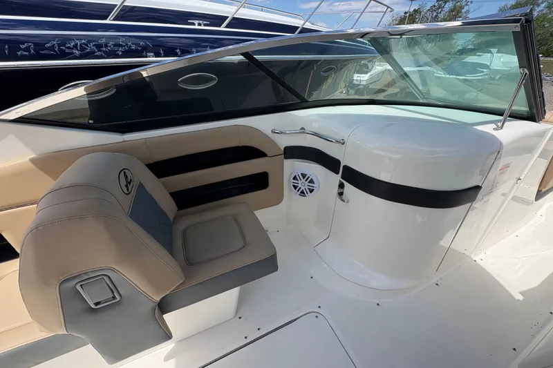 Slide: The Image of Interior of a 2015 Sea Ray 300 SLX boat, featuring beige seating and sleek design. - 17