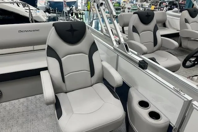 Slide: The Image of 2026 Berkshire 22UL LE B boat interior with plush seating and cup holders. - 10