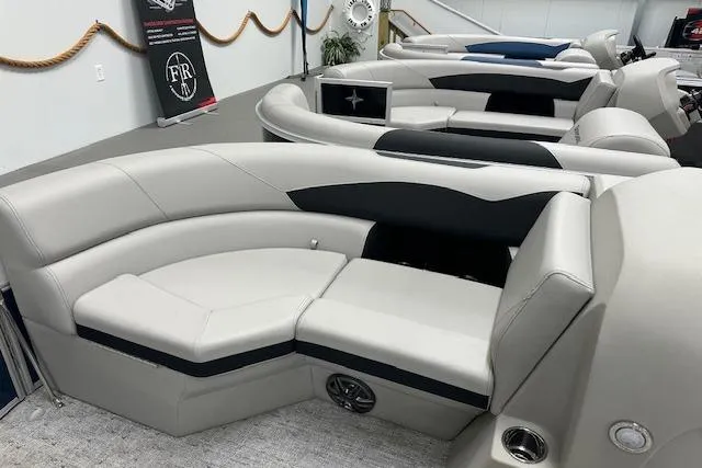 Slide: The Image of Luxurious seating on a 2026 Berkshire 22UL LE B pontoon boat, featuring sleek design and comfort. - 13