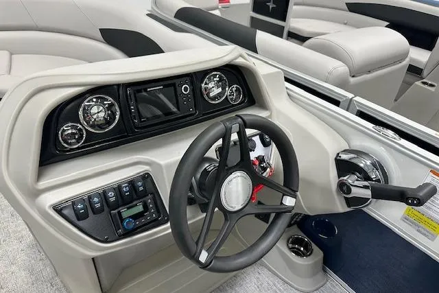Slide: The Image of Cockpit of 2026 Berkshire 22UL LE B boat with modern steering and controls. - 8