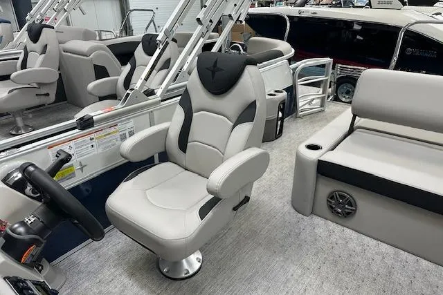Slide: The Image of Interior of a 2026 Berkshire 22UL LE B pontoon boat with plush seating. - 9
