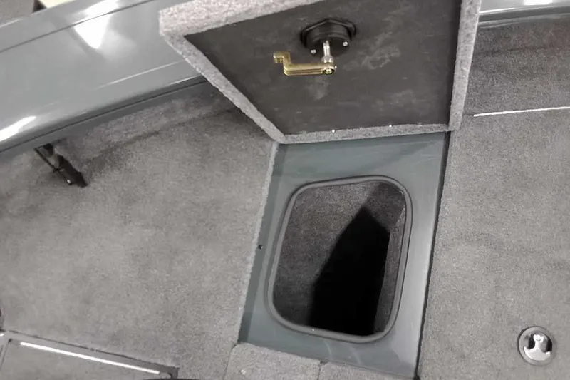Slide: The Image of Interior storage compartment of 2026 Ranger VX1888 WT boat, featuring carpeted flooring. - 12