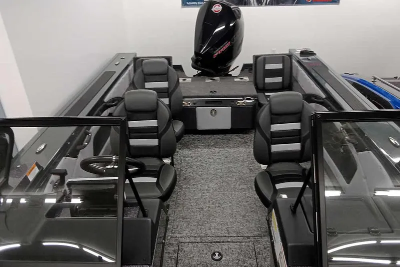 Slide: The Image of 2026 Ranger VX1888 WT boat interior with seating and motor, showcasing modern design. - 14