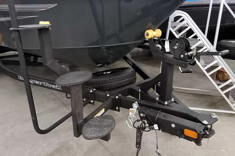 Slide: The Image of Trailer hitch and steps of 2026 Ranger VX1888 WT boat in showroom. - 3