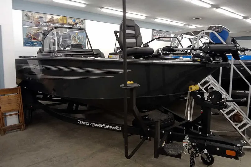 Slide: The Image of 2026 Ranger VX1888 WT boat displayed indoors on a trailer. - 30