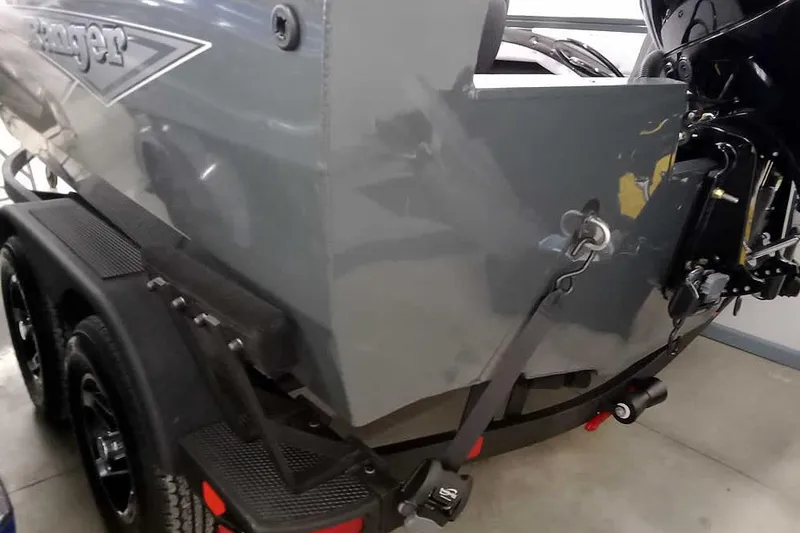 Slide: The Image of 2026 Ranger VX1888 WT boat on trailer, showcasing rear and motor details. - 5