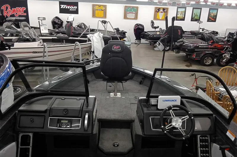 Slide: The Image of Interior view of a 2026 Ranger VX1888 WT boat in a showroom. - 7