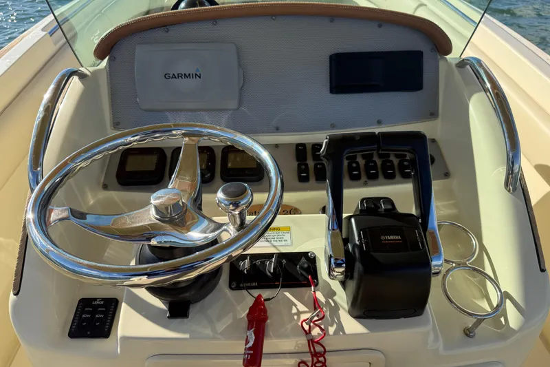 Slide: The Image of 2013 Chris-Craft Catalina 26 helm with Garmin navigation and Yamaha controls. - 21