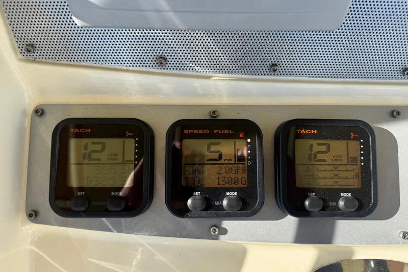 Slide: The Image of Digital gauges on a 2013 Chris-Craft Catalina 26 boat dashboard. - 22