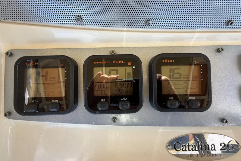 Slide: The Image of Dashboard of a 2013 Chris-Craft Catalina 26 with tachometer and speed fuel gauges. - 28