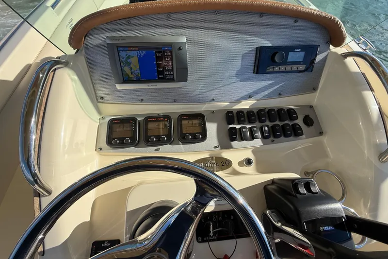 Slide: The Image of Helm of 2013 Chris-Craft Catalina 26 with navigation and control instruments. - 37