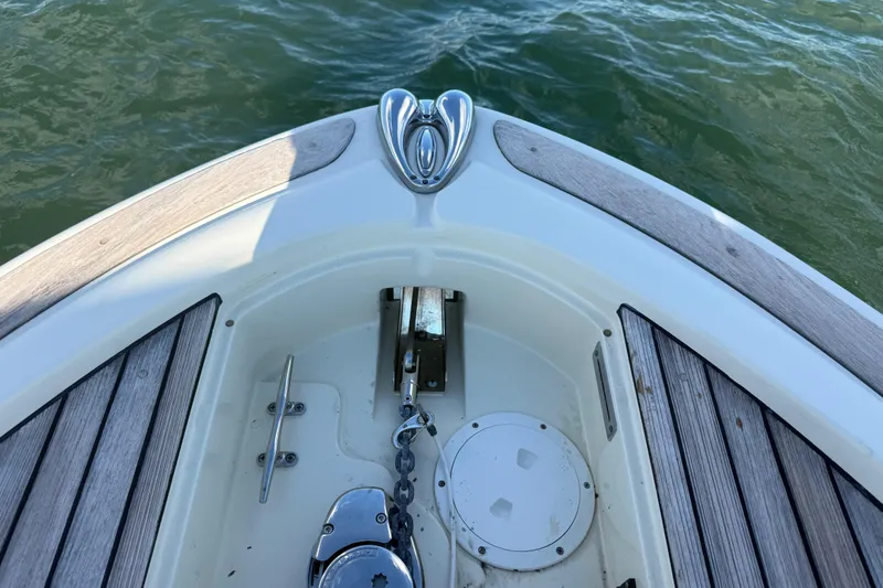 Slide: The Image of Bow of 2013 Chris-Craft Catalina 26 with anchor chain and teak decking. - 41