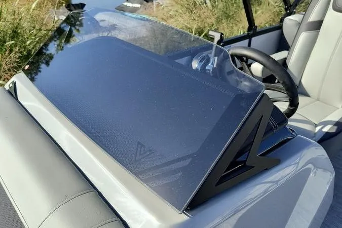 Slide: The Image of Viaggio V22U 2026 boat dashboard with steering wheel and windshield in a sleek design. - 7