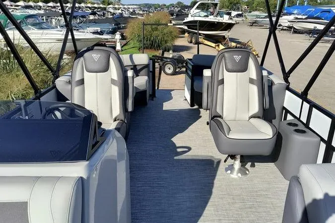 Slide: The Image of 2026 Viaggio V22U boat interior with modern seating at a marina. - 8