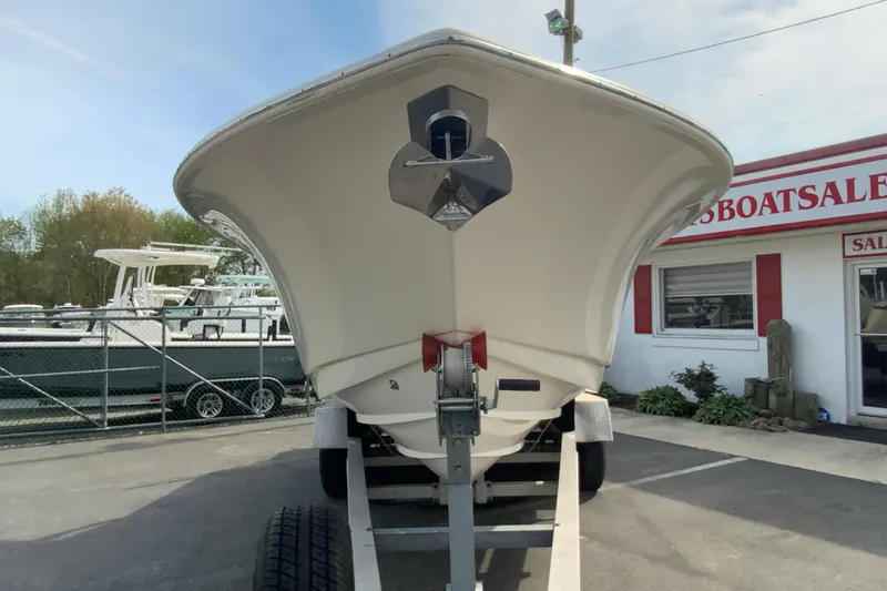 Slide: The Image of 2019 Scout 255 Dorado boat on trailer at dealership, front view. - 4