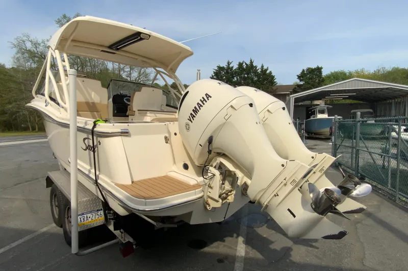 Slide: The Image of 2019 Scout 255 Dorado boat with Yamaha engines on a trailer. - 8