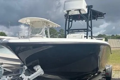 Slide: The Image of 2017 Yellowfin 26 Hybrid boat on trailer under cloudy sky. - 3