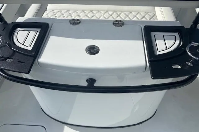 Slide: The Image of 2017 Yellowfin 26 Hybrid boat console with storage compartments and seating. - 5