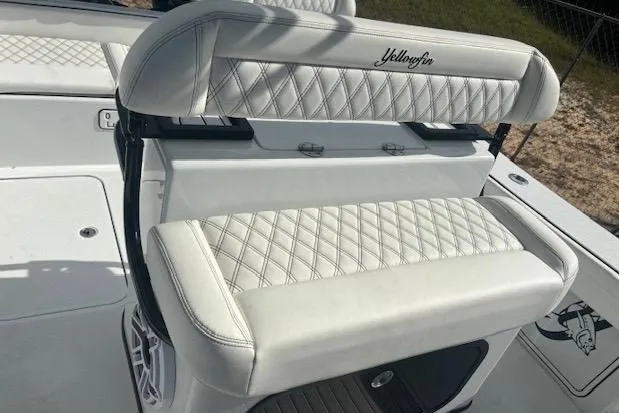 Slide: The Image of 2017 Yellowfin 26 Hybrid boat with white quilted seating and sleek design. - 8