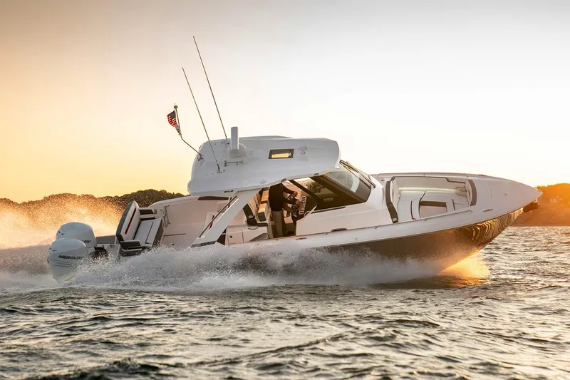 The Image of Manufacturer Provided Image: 2021 Tiara Sport 34 LS boat cruising at sunset. - 0