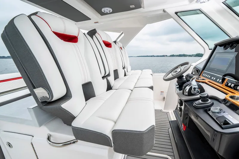 Slide: The Image of Manufacturer Provided Image: 2021 Tiara Sport 34 LS boat interior with luxurious seating and advanced helm controls. - 10