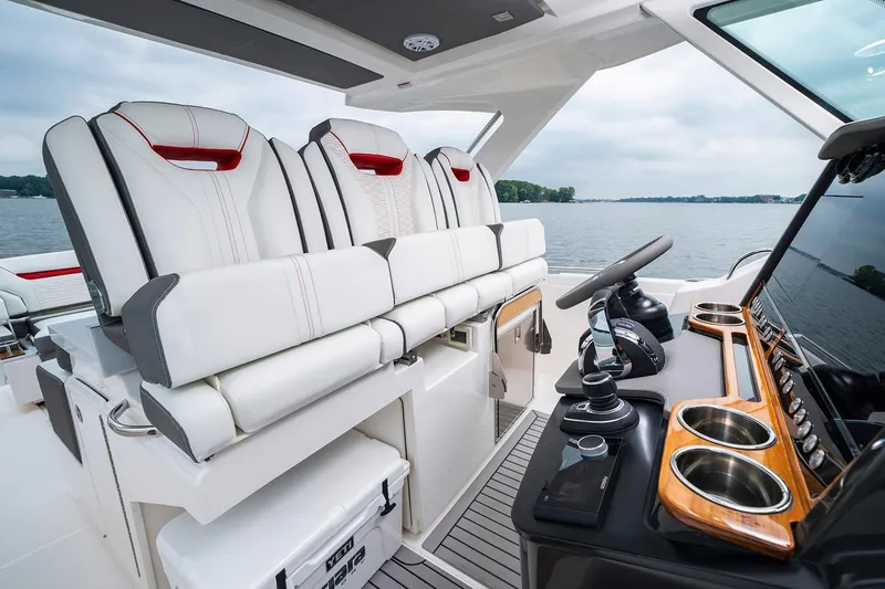 Slide: The Image of Manufacturer Provided Image: 2021 Tiara Sport 34 LS boat interior with luxurious seating and modern helm. - 11