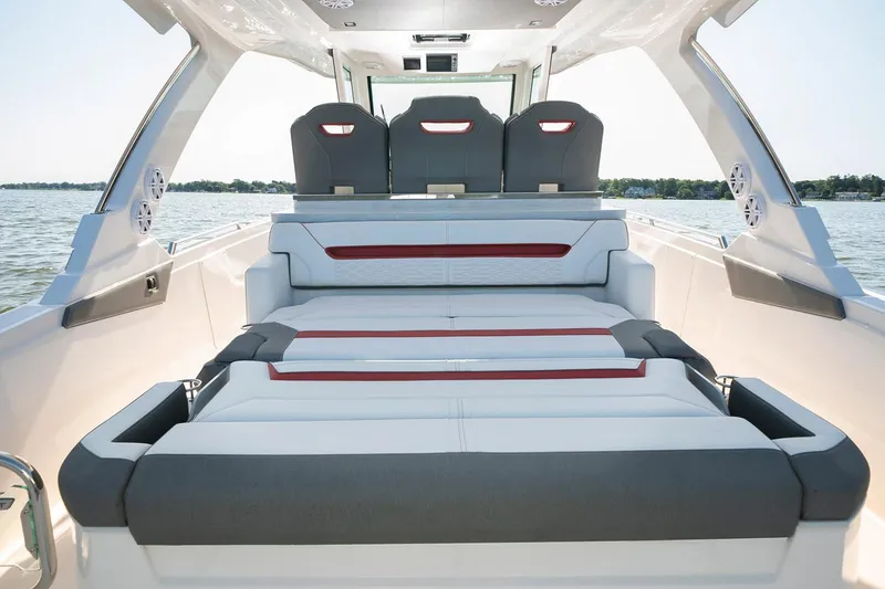 Slide: The Image of Manufacturer Provided Image: 2021 Tiara Sport 34 LS boat interior with luxurious seating and scenic water view. - 12